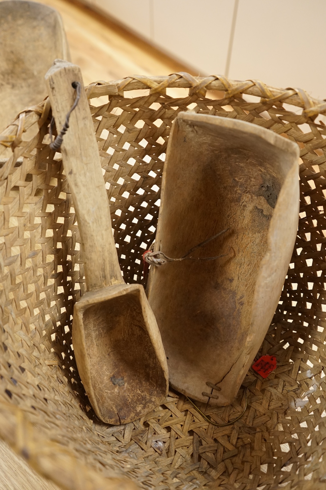 Tribal interest; A collection of various African carvings, a basket and spear